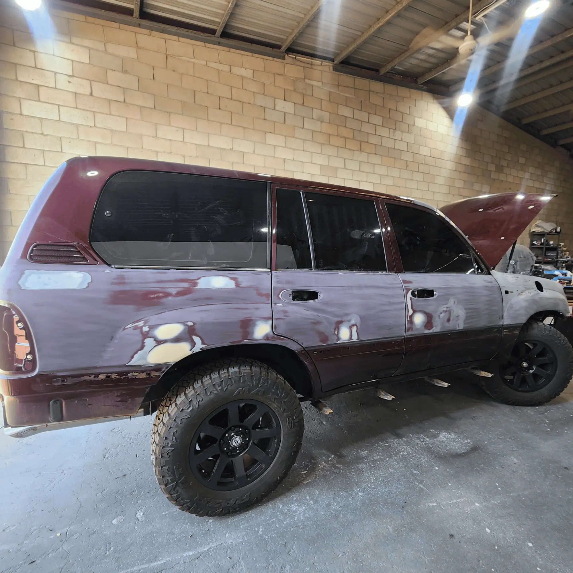 Excellent Spraypainting on Metallic Red 100 Series Landcruiser